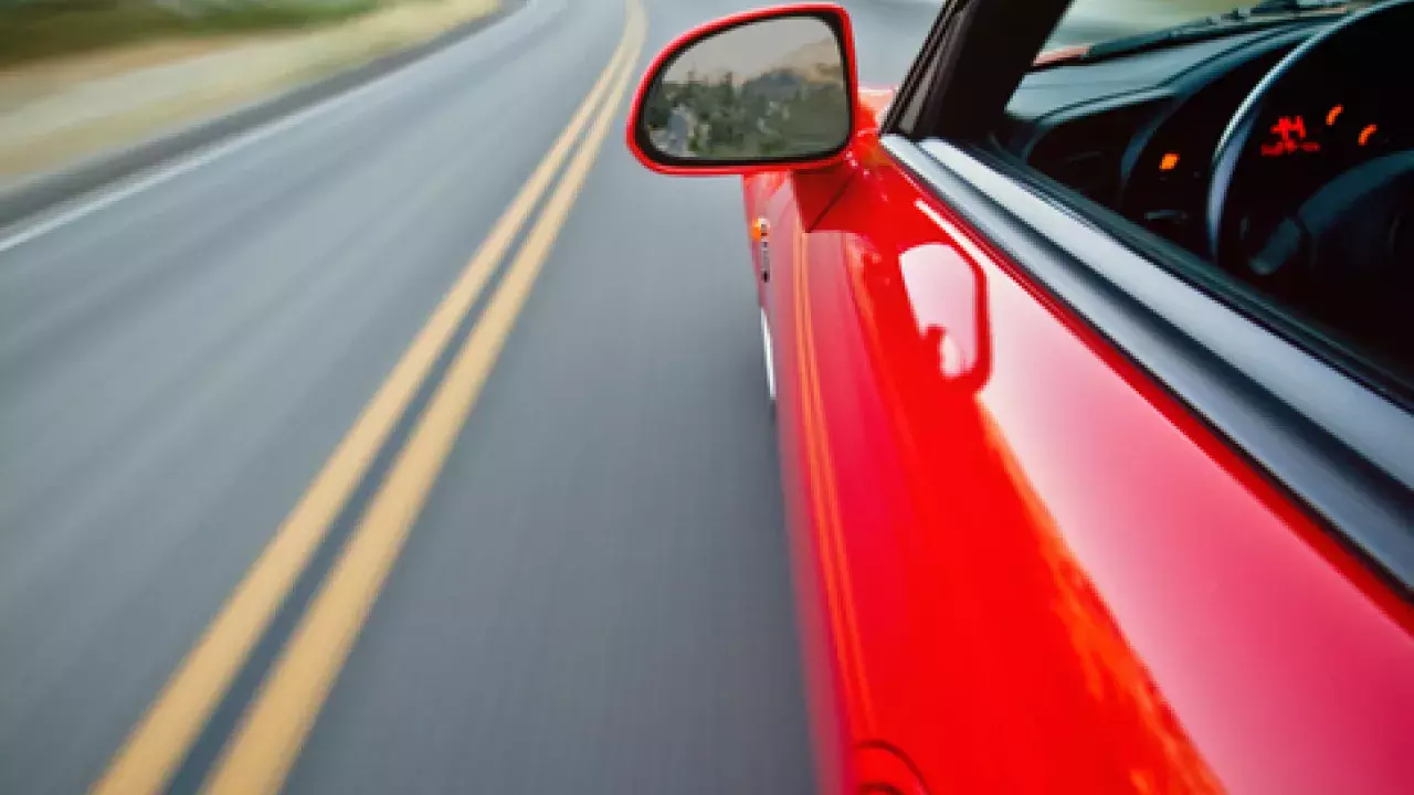 Red car driving