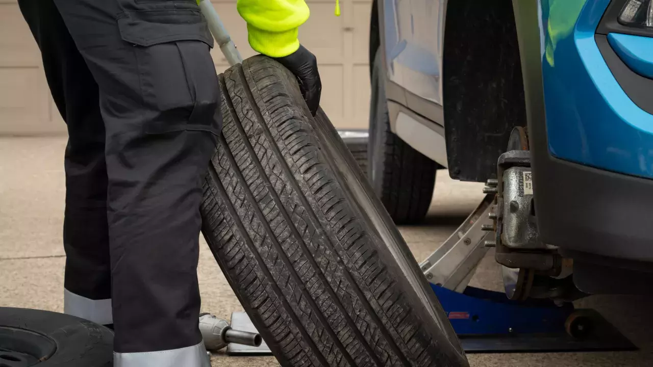 technician changing a tire