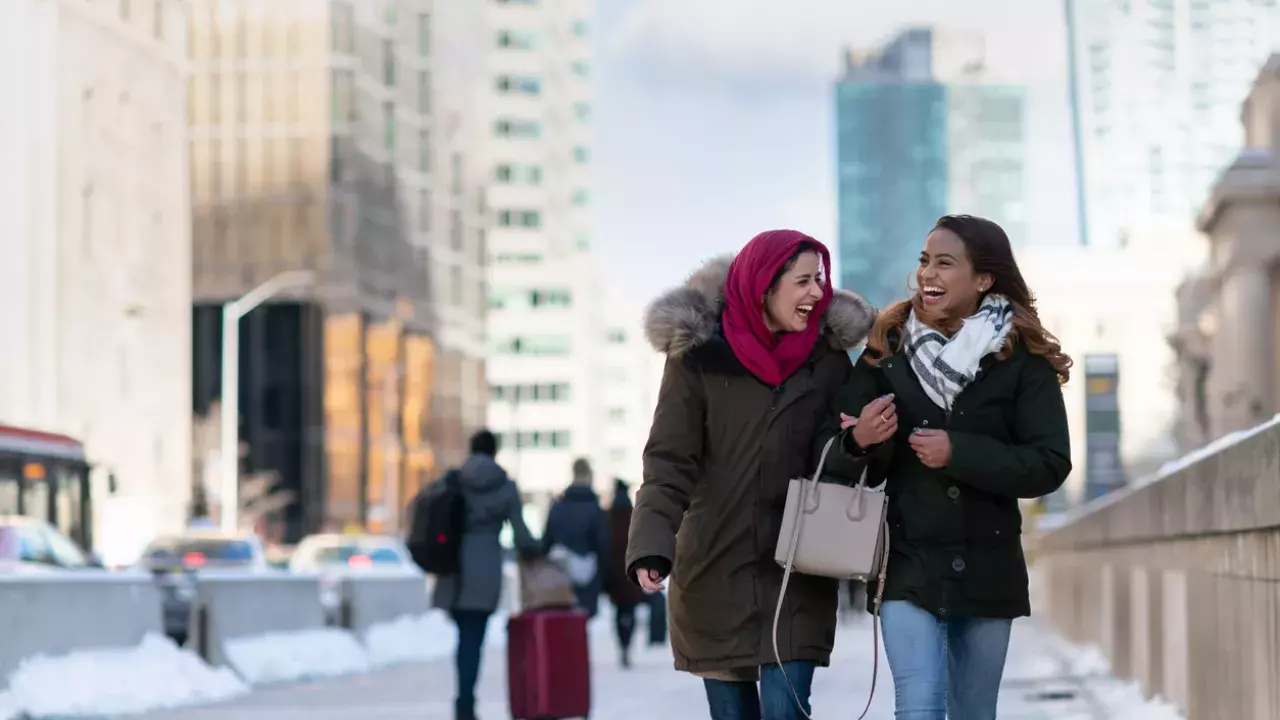 female friends walking through the city