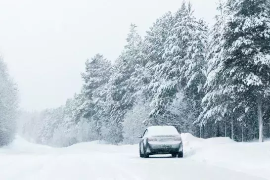 Car on country winter road