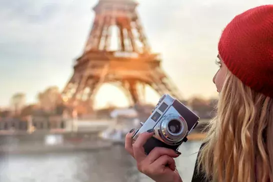 Woman taking photos in France 