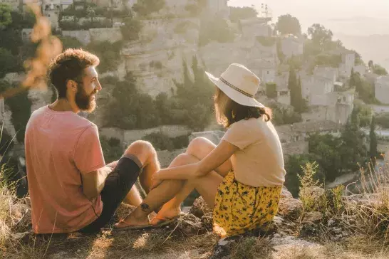 Woman and man looking at scenic view of Gordes village in Provence