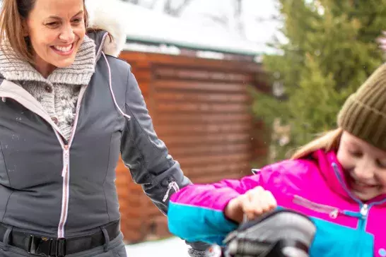 Mother and Daughter packing their car for a ski trip