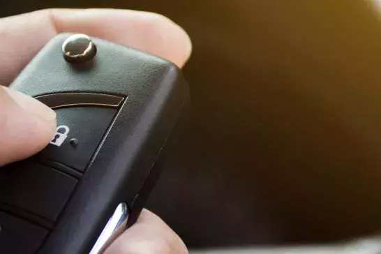 Holding a Car Fob Key