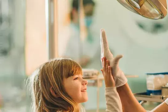 Mother and daughter at the dentist.