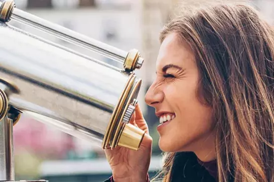 Women looking through telescope