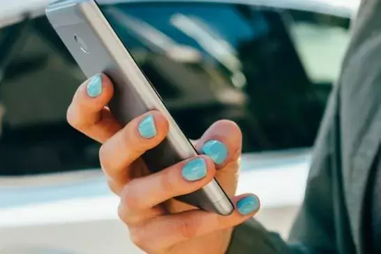 Woman on her cellphone outside 