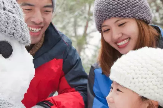 Family building snowman