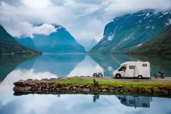 Family vacation travel RV, holiday trip in motorhome, Caravan car Vacation. Beautiful Nature Norway natural landscape.