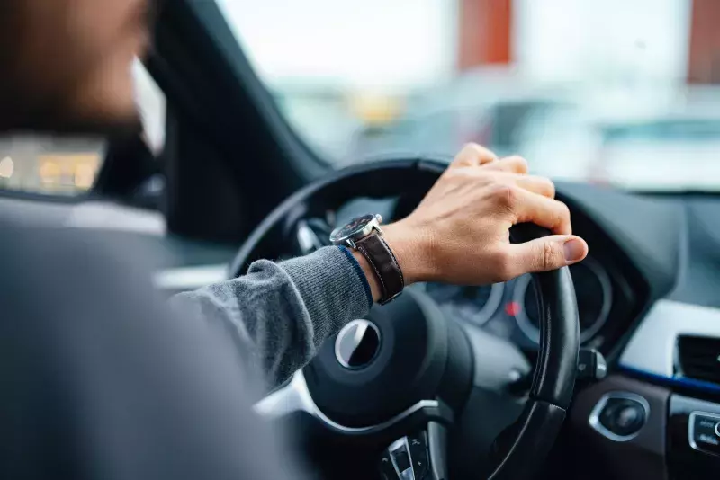 Close up of a male driving