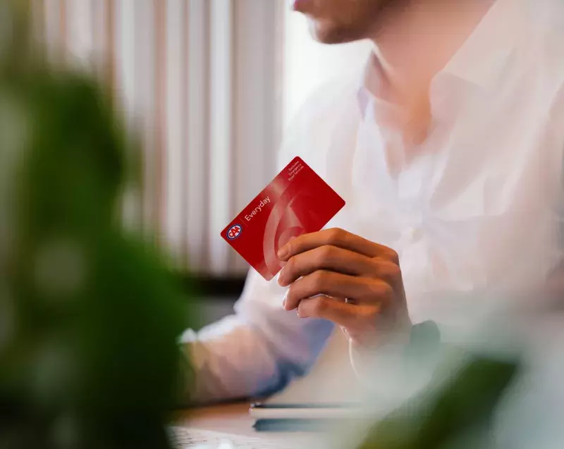 man holding CAA Everyday Membership card