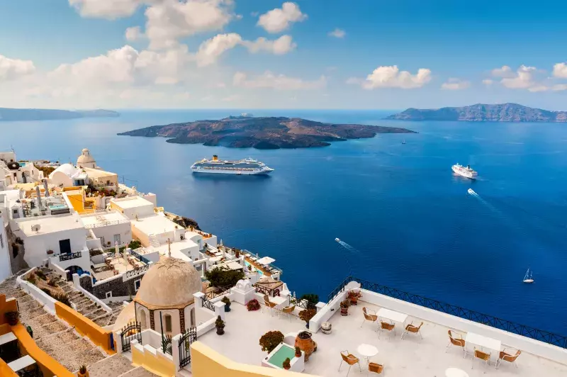 A shot of two cruise ships at the port at Santorini, Greece