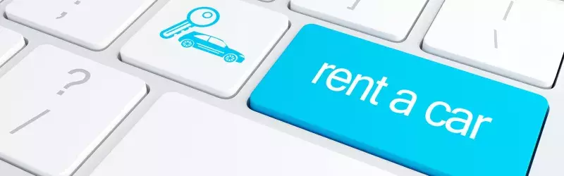 keyboard with "rent a car" on key