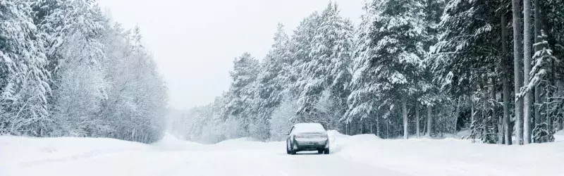 Car on country winter road