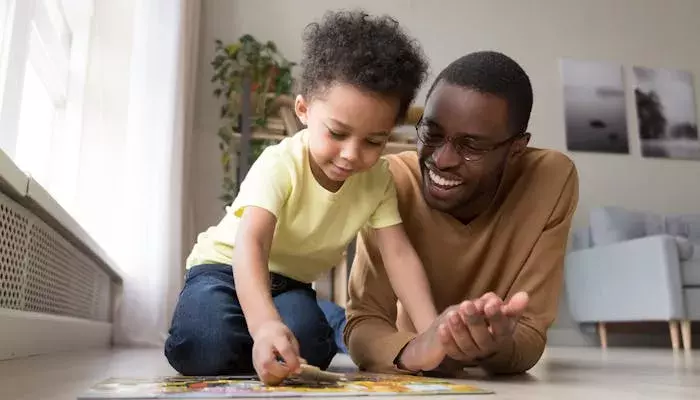 Father and son playing a game