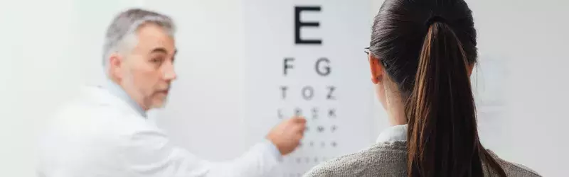 Man pointing at eye test