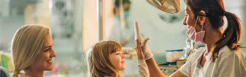 Mother and daughter at the dentist.