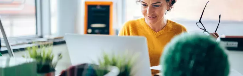 Photo of mature woman making choices about home and auto insurance.