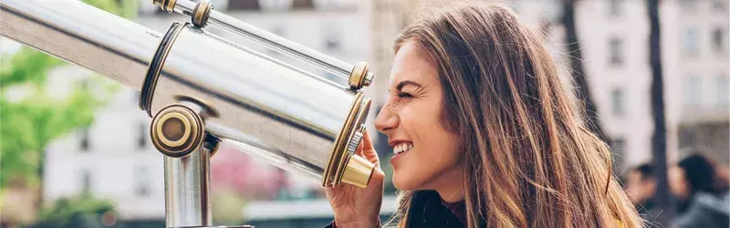 Women looking through telescope