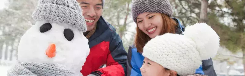 Family building snowman