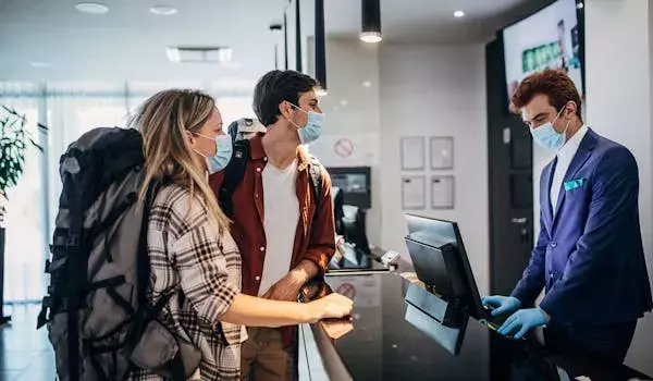 hotel check in covid masks gloves safety