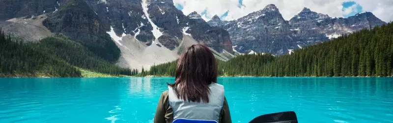 Woman canoeing in the Canadian Rockies 