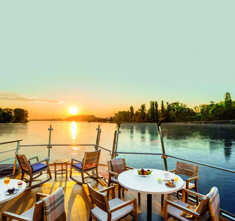 Aquavit Terrace at dawn with breakfast on the table onboard the