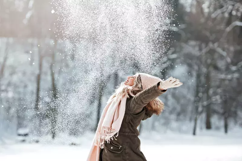 woman enjoying in the snow