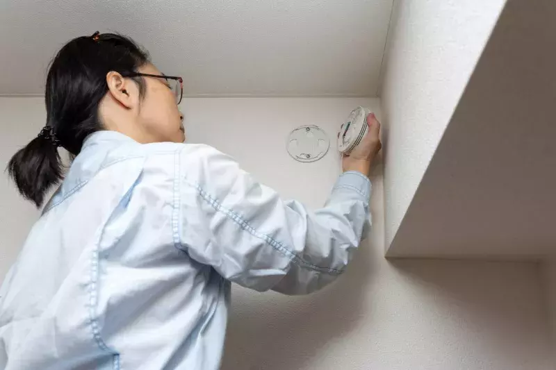 Woman checking house equipment