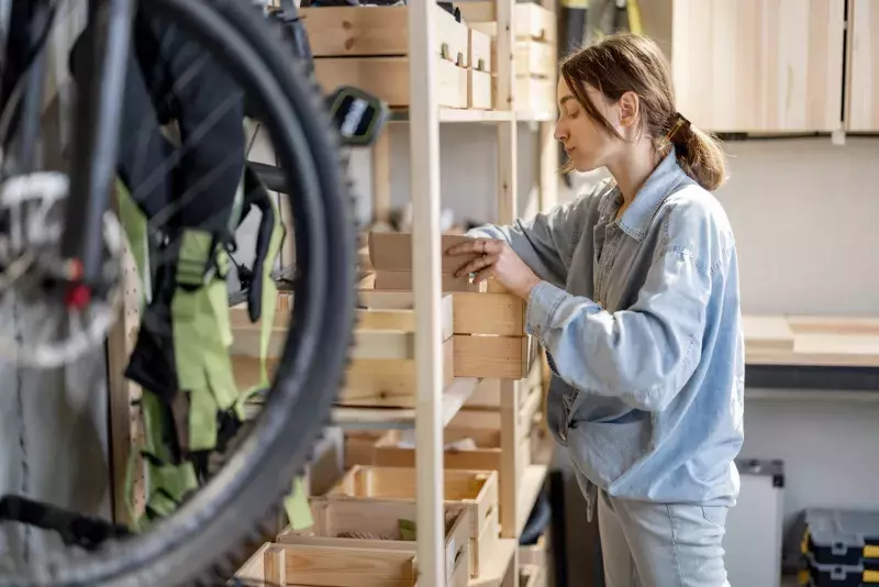 Woman searching some tools in the workshop