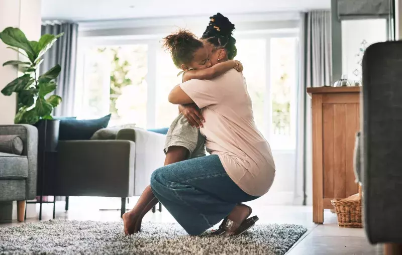 mother and child hugging at home