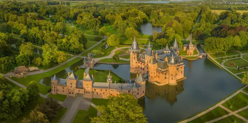 View of castle De Haar enchanting with typical towers and a fairy tale-like facade, which gleams on bright days and lush landscaping gardens. Neo-Gothic Kasteel de haar.