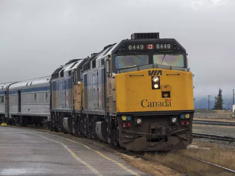 VIA Rail train is stopped at a station in Banff