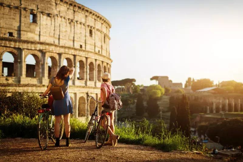 Tourist women in Rome: by the Coliseum